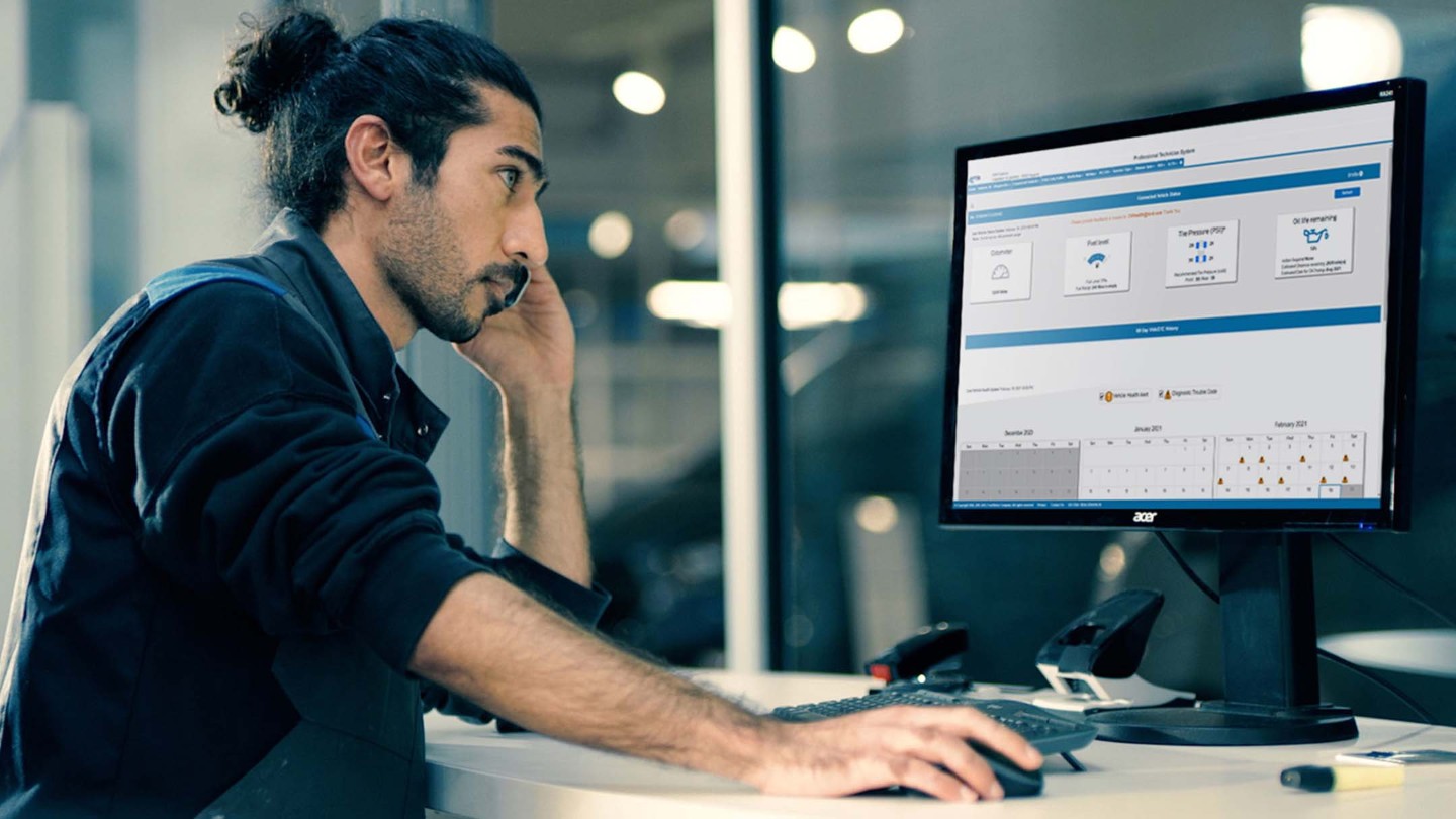 Person checking managing fleet on computer