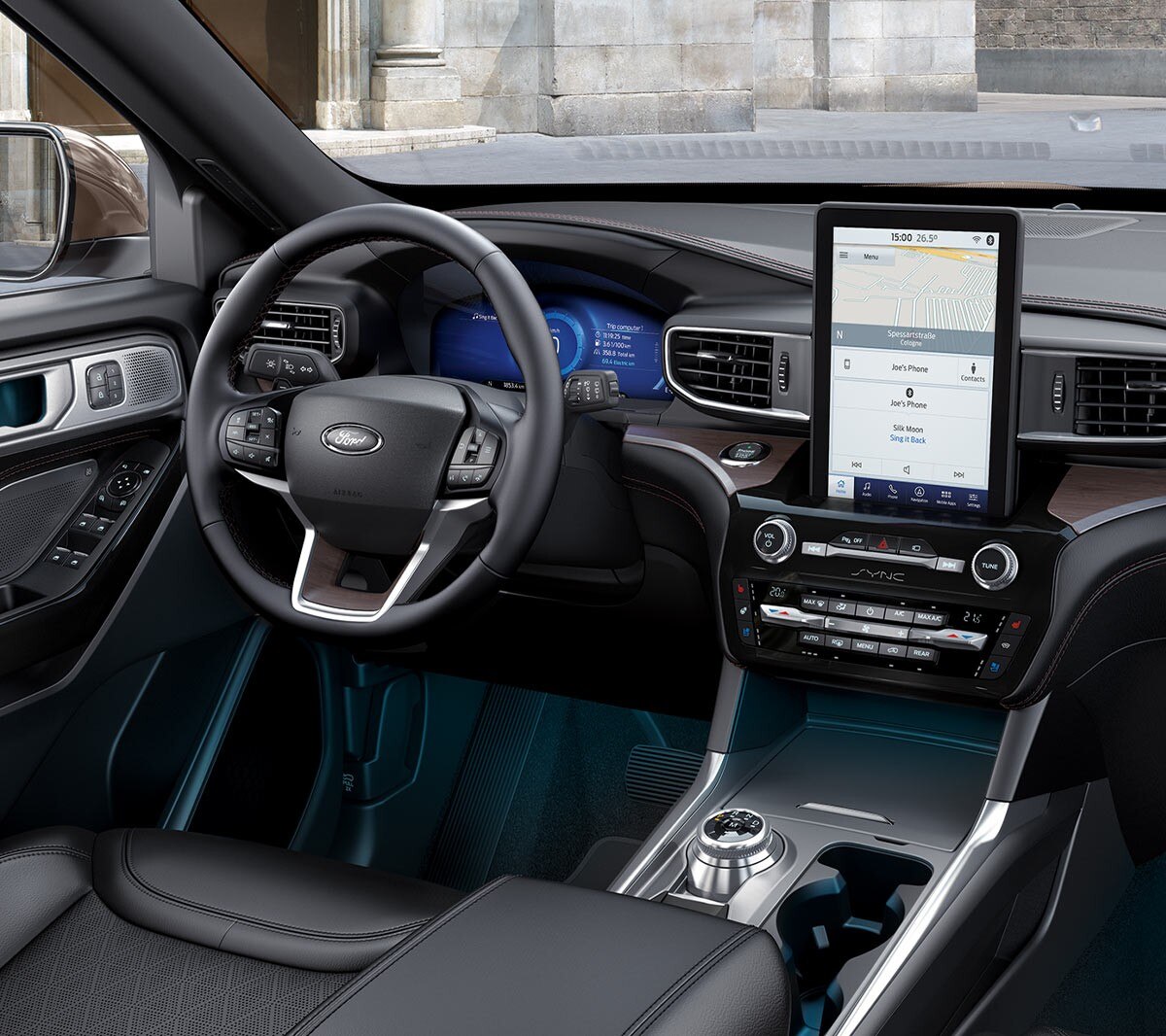 Ford Mondeo interior front viewed from back with person sitting in driver seat checking rear view camera