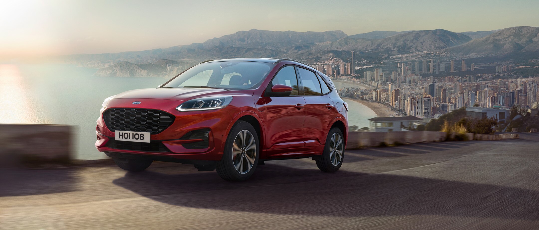 Ford Kuga driving out of a city Ford Kuga driving out of a city