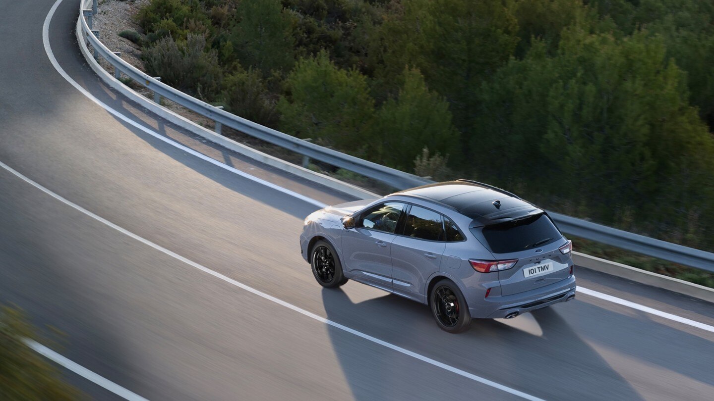 All new Ford Kuga driving on road showing lane keeping