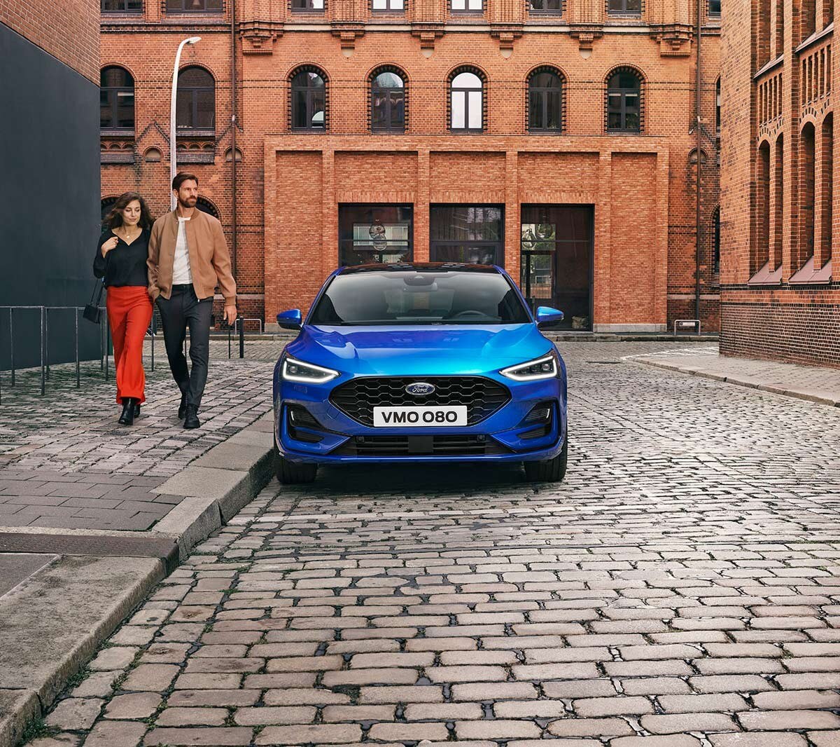 Ford Focus in front view parked next to a sidewalk