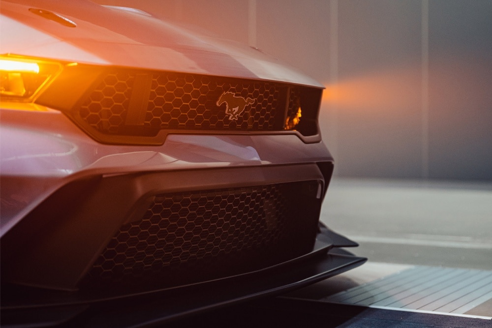 Ford Mustang GTD with lowered suspension and headlights on