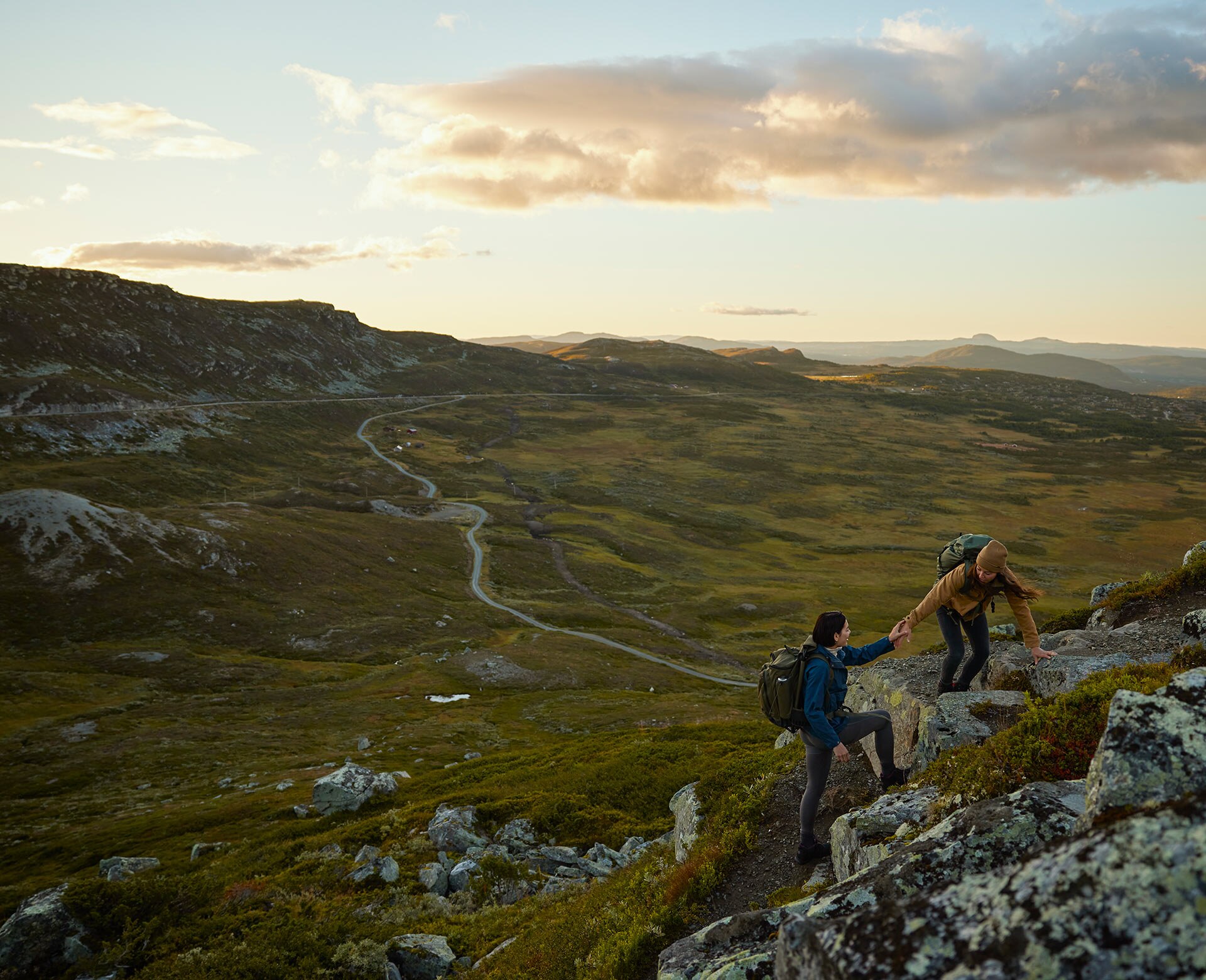 People climbing a hill in the wilderness