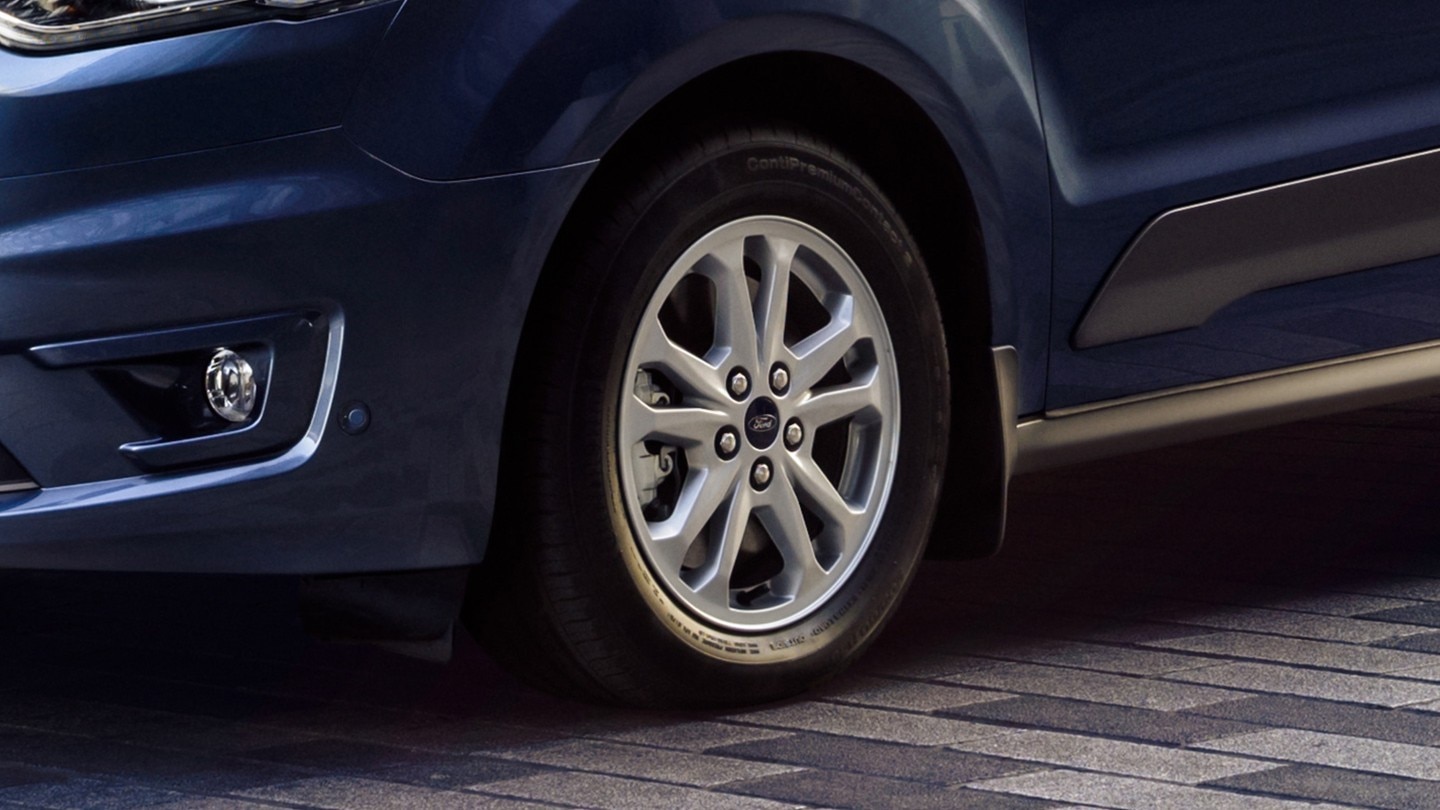 Blue Ford Transit Connect wheel close up