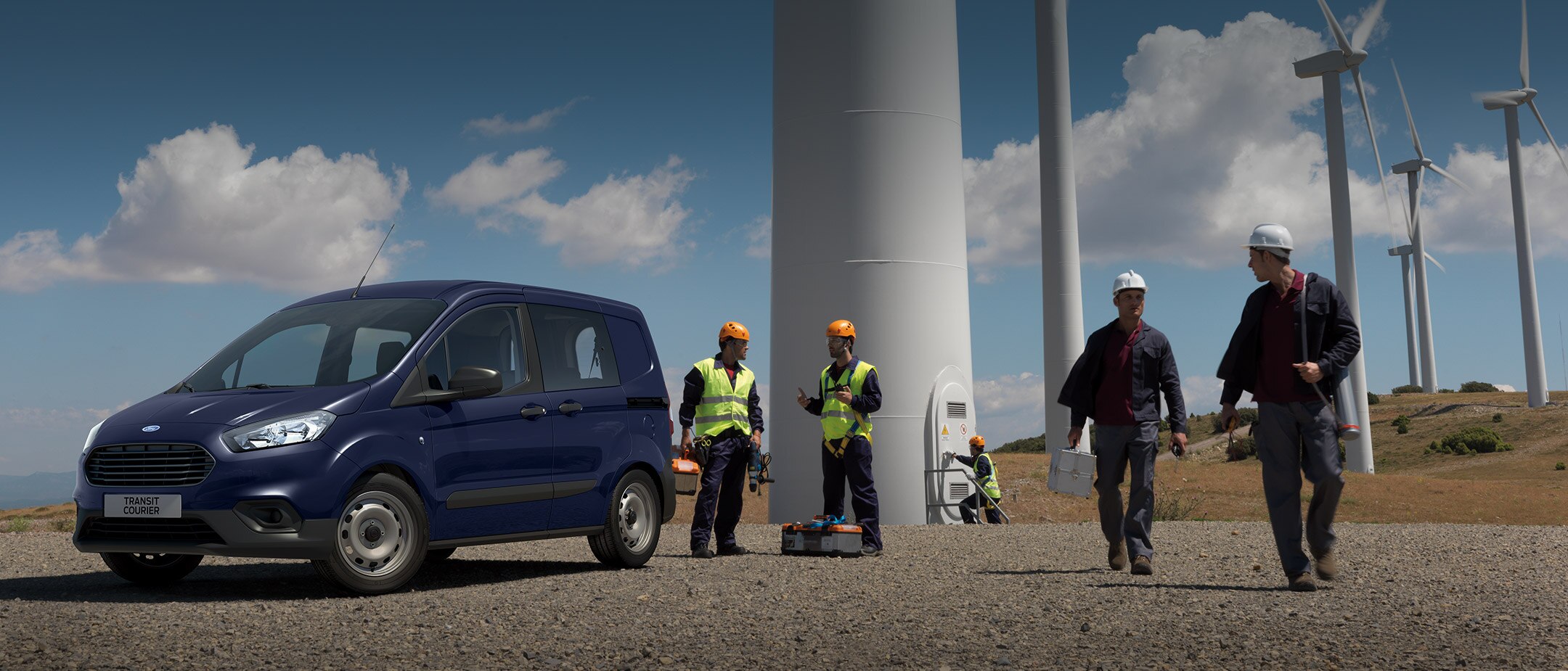 New Dark Blue Ford Transit Custom Parked with workmen in high vis jackets