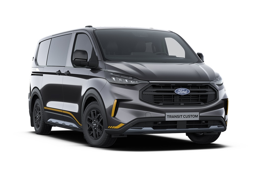 Egy sötétszürke Ford Transit Custom Trail duplakabinos áruszállító aranyszínű dekorcsíkokkal.