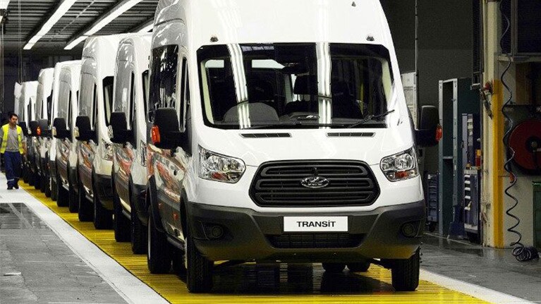 Ford Transits standing in row in factory