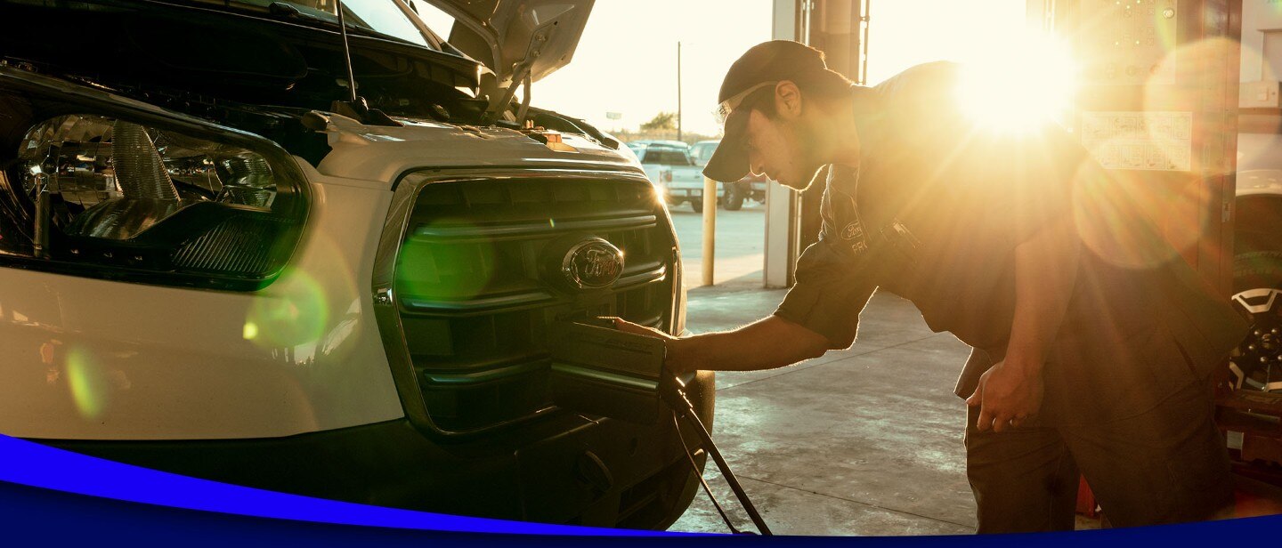 Man charging an electric van